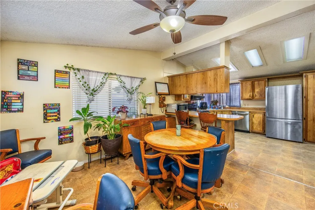 7717 Church Street, Unit 160 Highland, CA 92346 - Photo 17 of 37 a view of a dining room with furniture