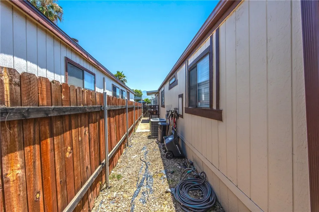 7717 Church Street, Unit 160 Highland, CA 92346 - Photo 33 of 37 a view of a balcony with wooden floor and stairs
