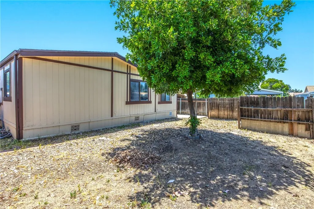 7717 Church Street, Unit 160 Highland, CA 92346 - Photo 35 of 37 a backyard of a house with lots of green space