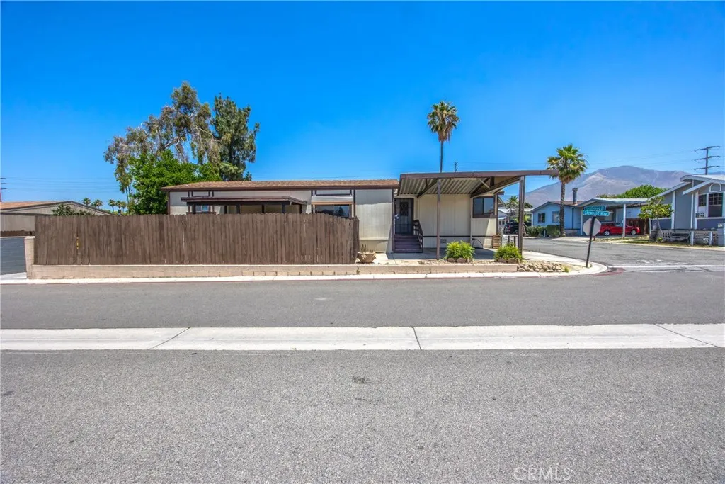 7717 Church Street, Unit 160 Highland, CA 92346 - Photo 4 of 37 a view of street with tall buildings