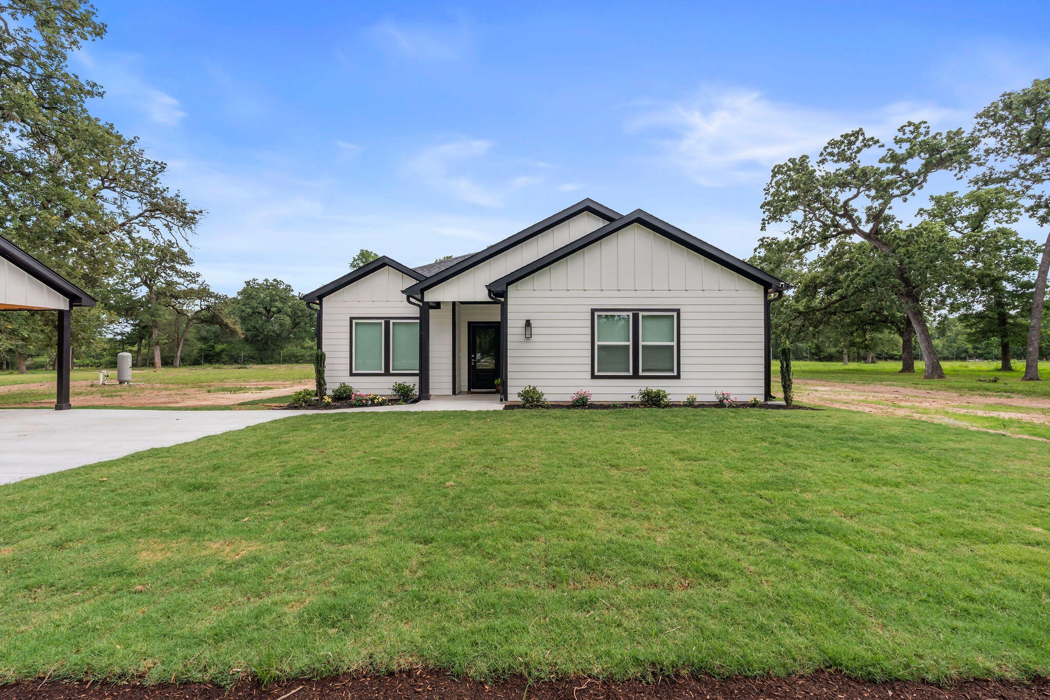 39645 Bosque Road Hempstead, TX 77445 - Photo 31 of 37 a view of a house with a backyard