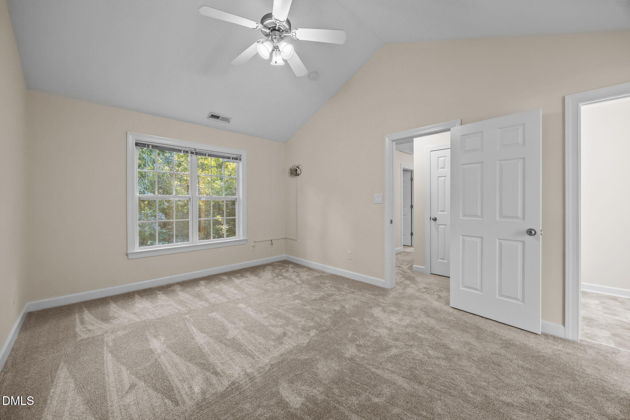 505 Vinson Road Clayton, NC 27527 - Photo 19 of 31 an empty room with fan and windows