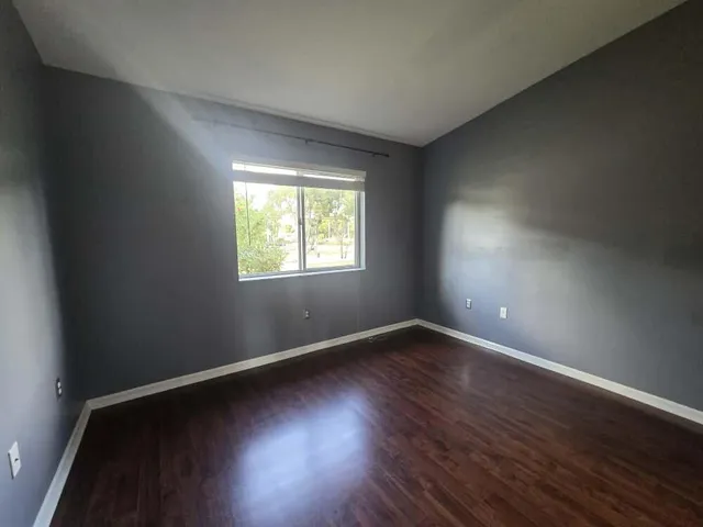 a kitchen with a refrigerator and a stove top oven