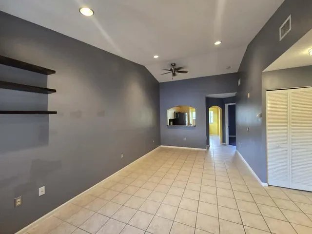 a view of an empty room and window