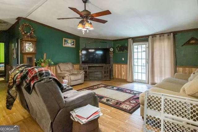 a living room with furniture and a flat screen tv