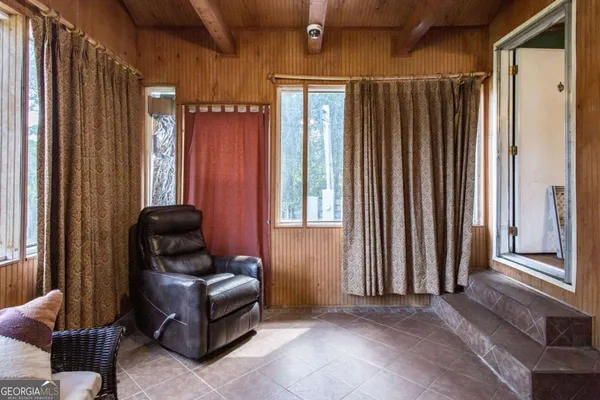 a living room with furniture and a window