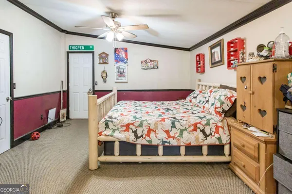 a bedroom with bed and cabinets