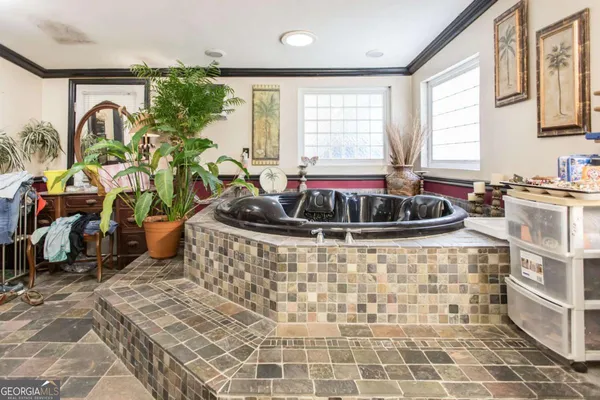 a table with a potted plant sitting on a floor