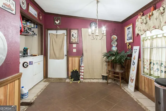 a view of hall way with furniture