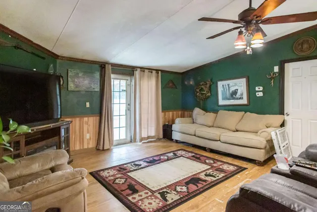 a living room with furniture and a flat screen tv