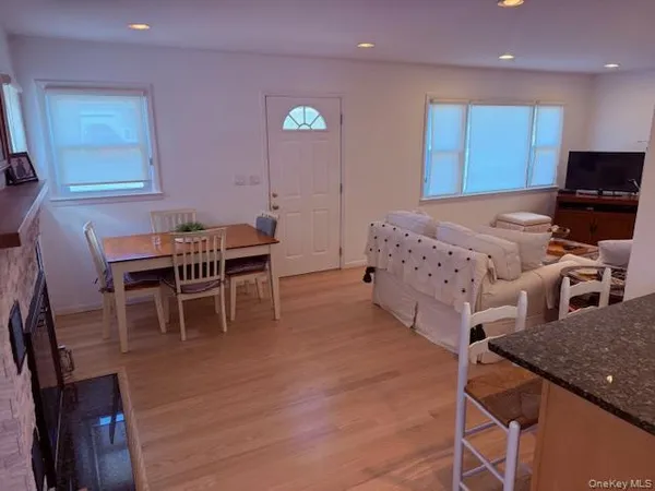 a bed room with furniture and a wooden floor