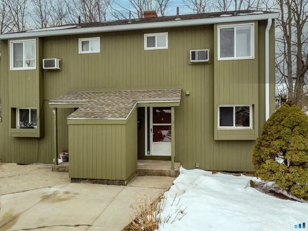 a front view of a house with a garage