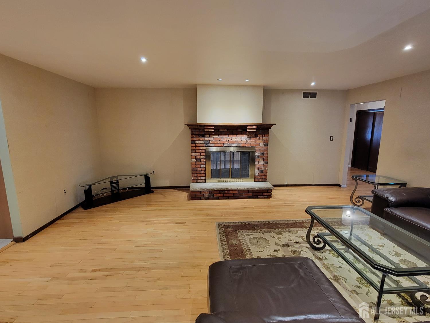 14 Perry Avenue Monroe Township, NJ 08831 - Photo 11 of 37 a room with furniture and a flat screen tv