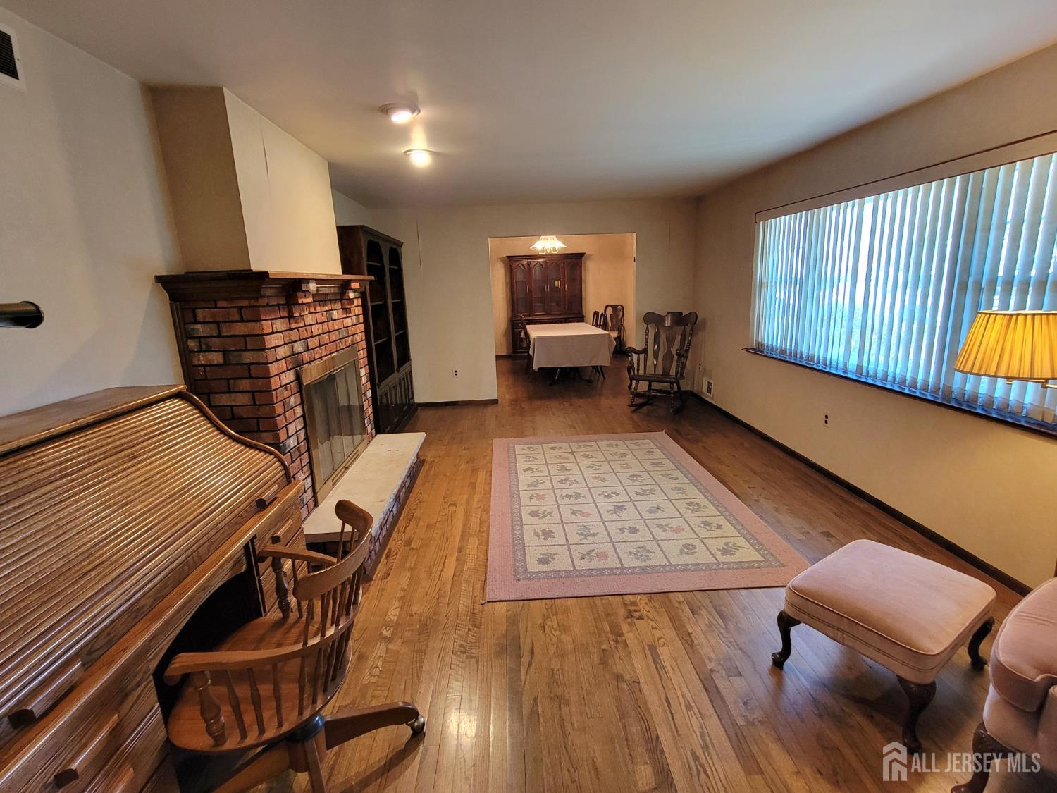 14 Perry Avenue Monroe Township, NJ 08831 - Photo 14 of 37 a view of a room with furniture wooden floor and window