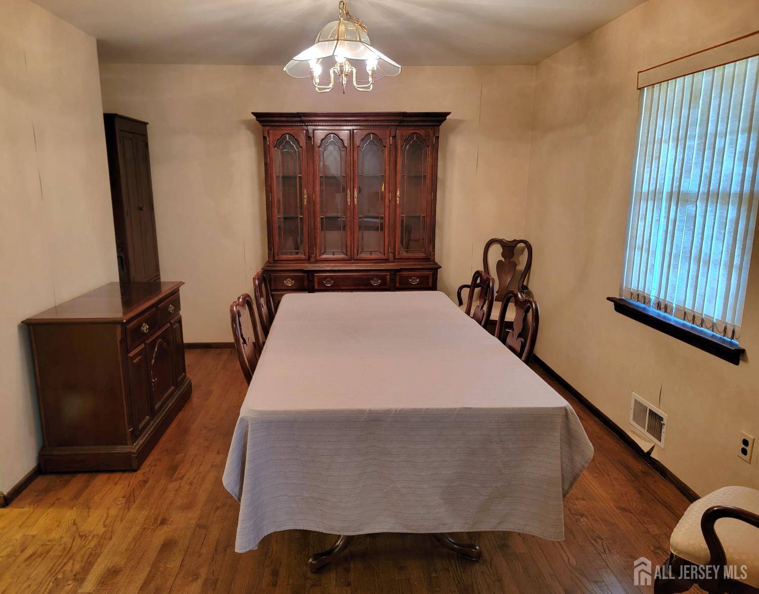 14 Perry Avenue Monroe Township, NJ 08831 - Photo 15 of 37 a bed sitting in a bedroom next to a window