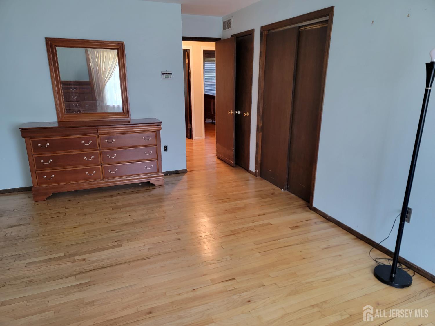 14 Perry Avenue Monroe Township, NJ 08831 - Photo 17 of 37 a view of room with wooden floor and chair