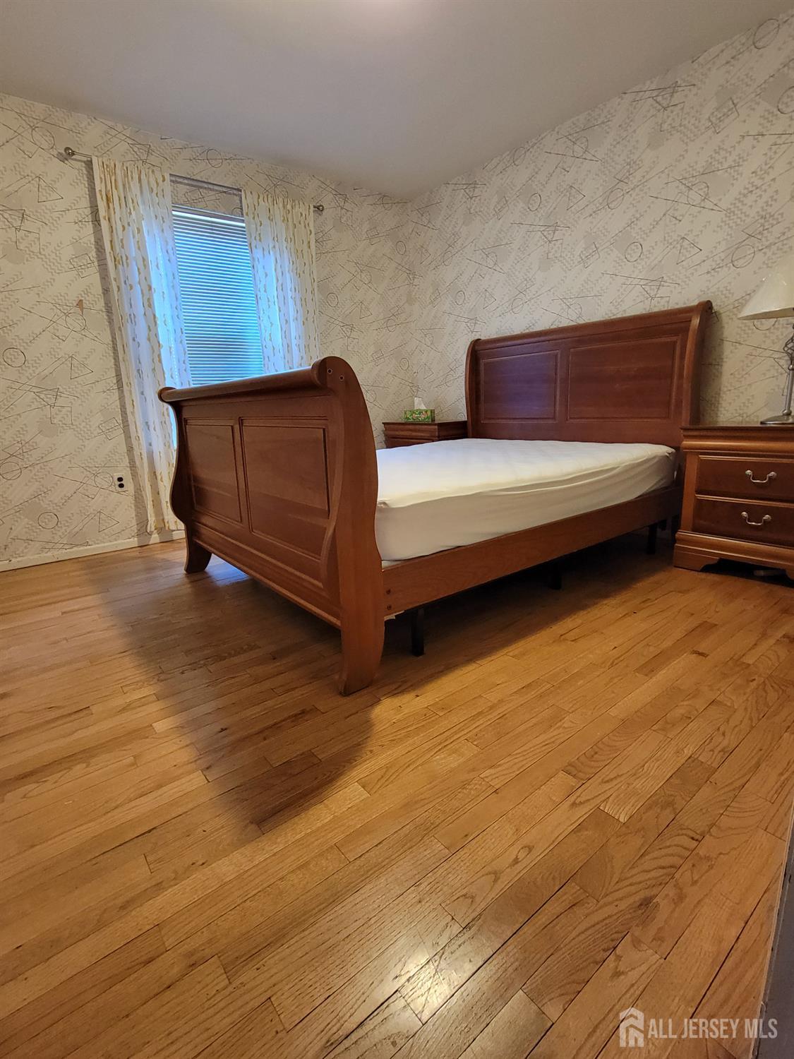 14 Perry Avenue Monroe Township, NJ 08831 - Photo 26 of 37 a living room with furniture and a wooden floor
