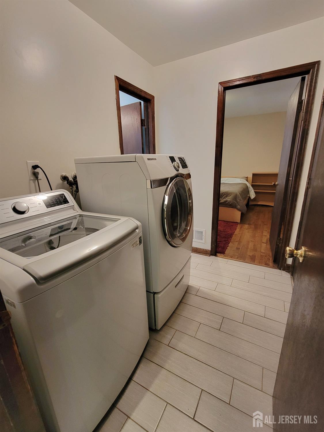 14 Perry Avenue Monroe Township, NJ 08831 - Photo 29 of 37 a utility room with dryer and washer