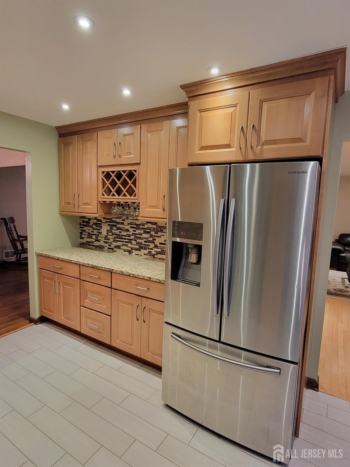 14 Perry Avenue Monroe Township, NJ 08831 - Photo 5 of 37 a kitchen with stainless steel appliances granite countertop a refrigerator and a sink