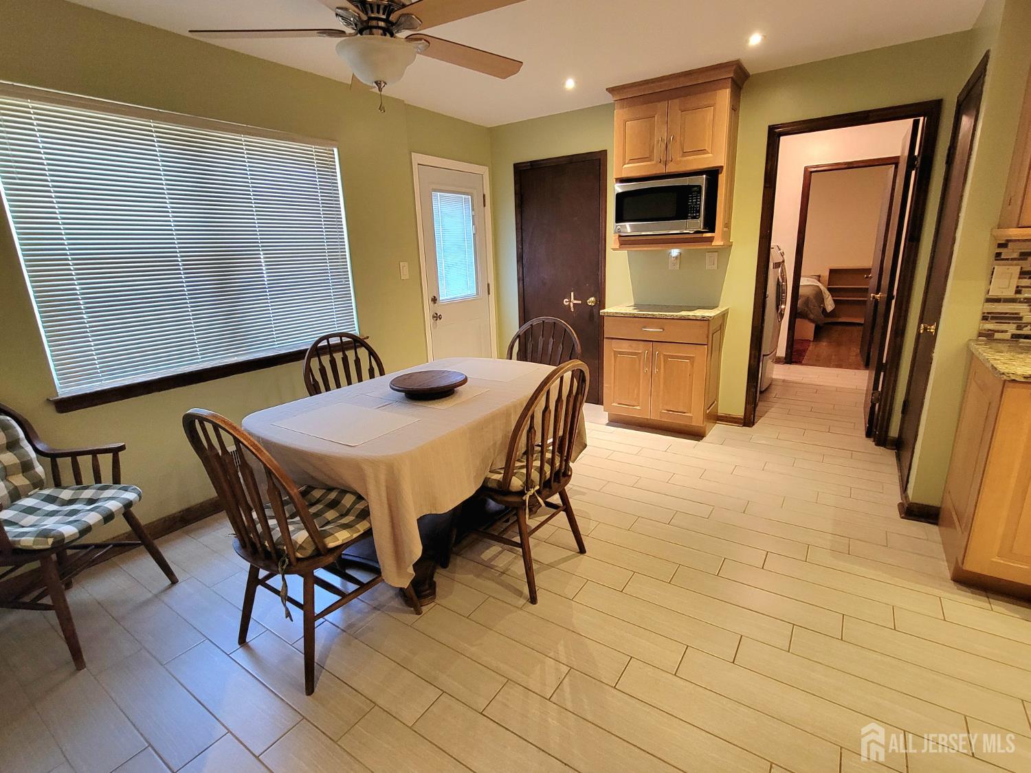 14 Perry Avenue Monroe Township, NJ 08831 - Photo 7 of 37 a dining room with furniture and a window