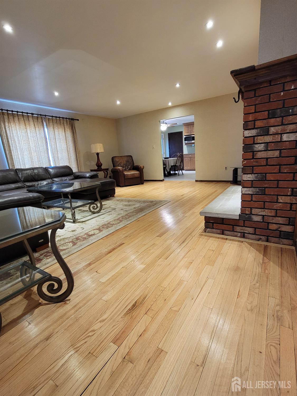 14 Perry Avenue Monroe Township, NJ 08831 - Photo 9 of 37 a room with furniture and a flat screen tv