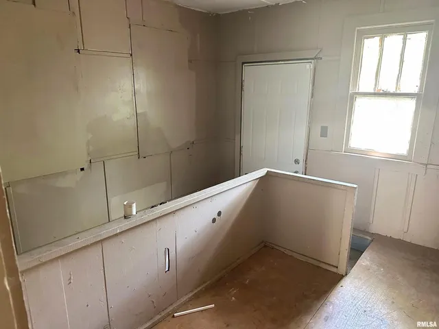 a view of a kitchen with cabinets