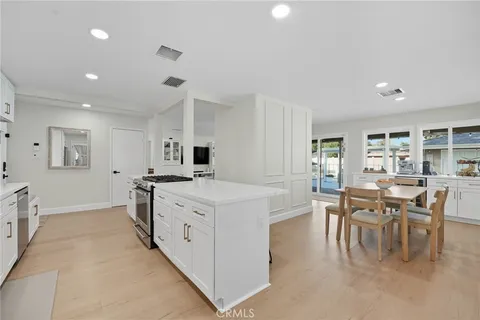 a large kitchen with a lot of counter space and a sink