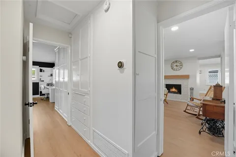 a bedroom with a bed wooden floor and window
