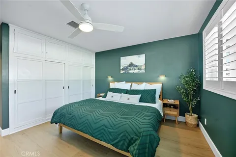 a bathroom with a granite countertop toilet a sink and shower