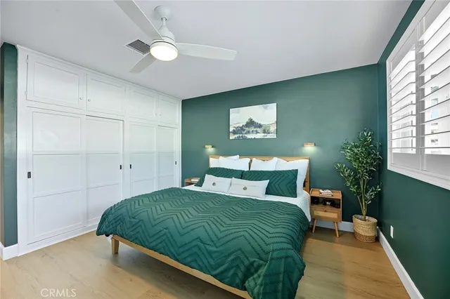 a bathroom with a granite countertop toilet a sink and shower