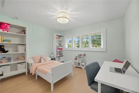a bedroom with a bed and cabinets