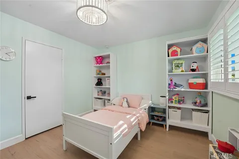 a bathroom with a sink a toilet and a window