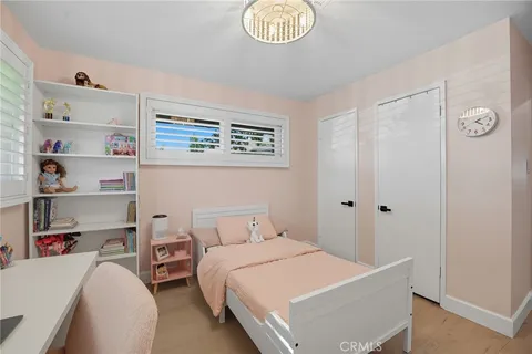 a view of a house with a swimming pool and a chairs