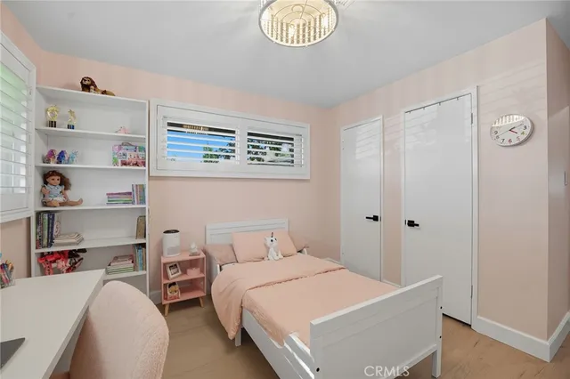 a view of a house with a swimming pool and a chairs