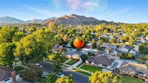 an aerial view of a house with a swimming pool