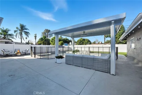 a living room with patio furniture
