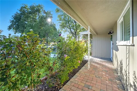 a view of a swimming pool and a yard with lake view