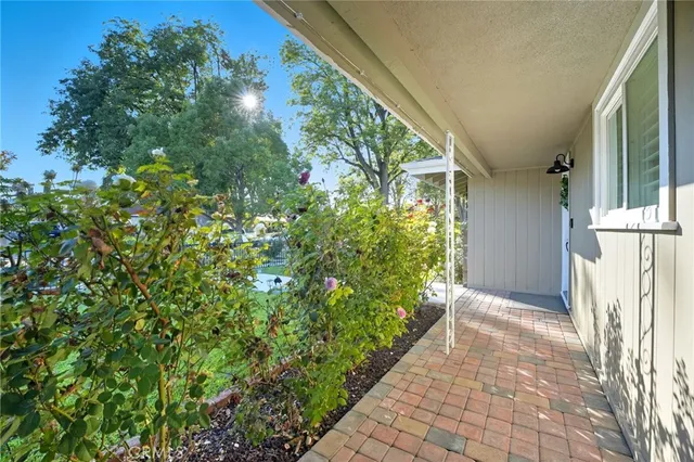a view of a swimming pool and a yard with lake view