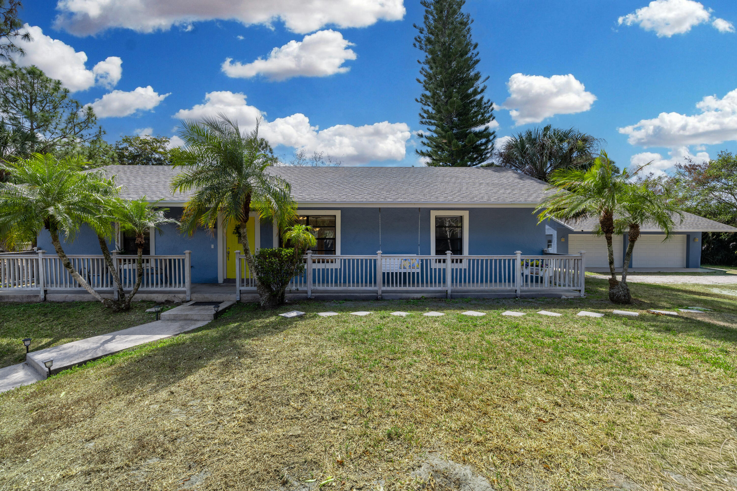 15400 76th Road North Loxahatchee, FL 33470 - Photo 1 of 39 a view of a house with a swimming pool