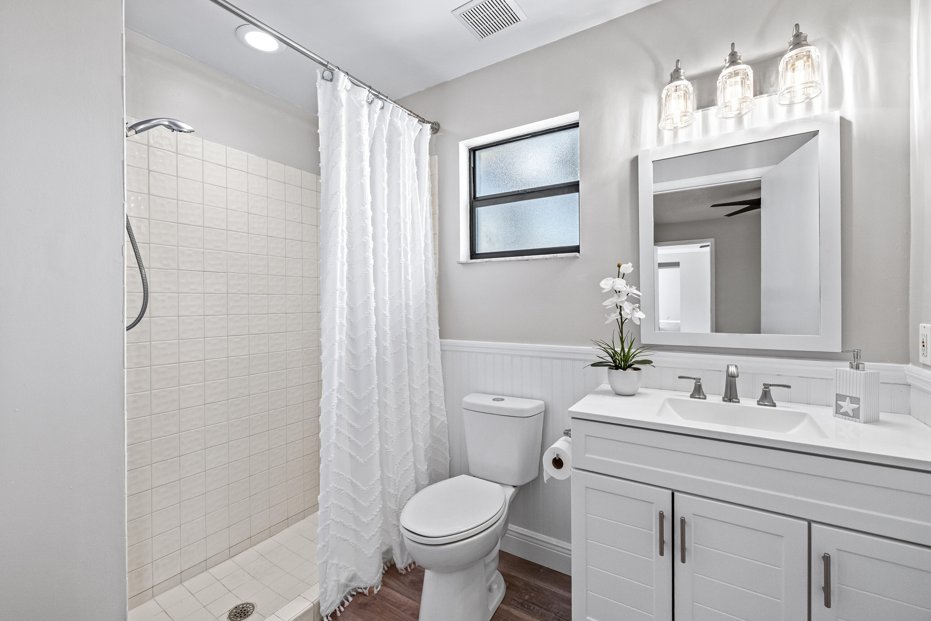 15400 76th Road North Loxahatchee, FL 33470 - Photo 15 of 39 a bathroom with a granite countertop toilet sink and shower