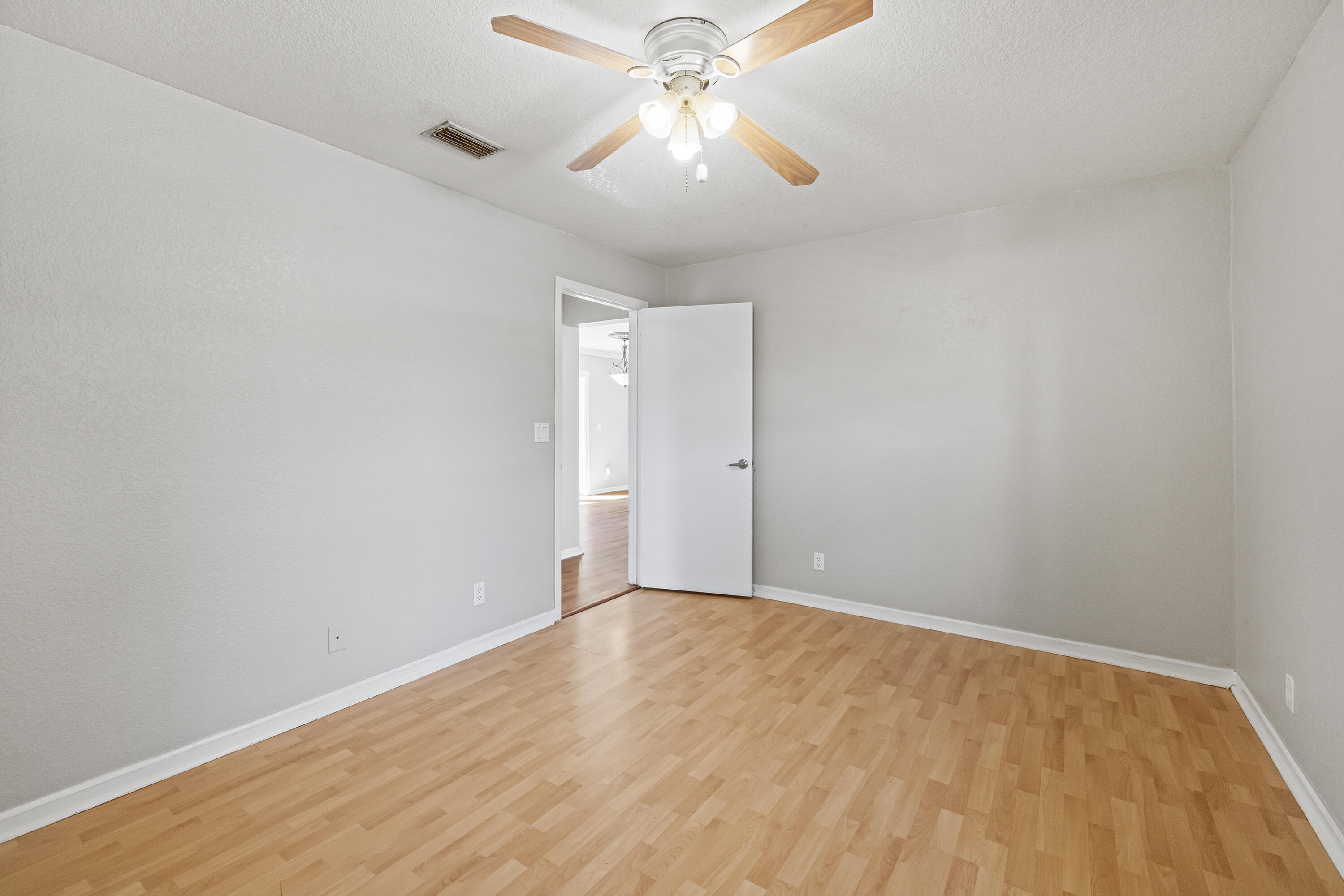 15400 76th Road North Loxahatchee, FL 33470 - Photo 18 of 39 wooden floor in an empty room
