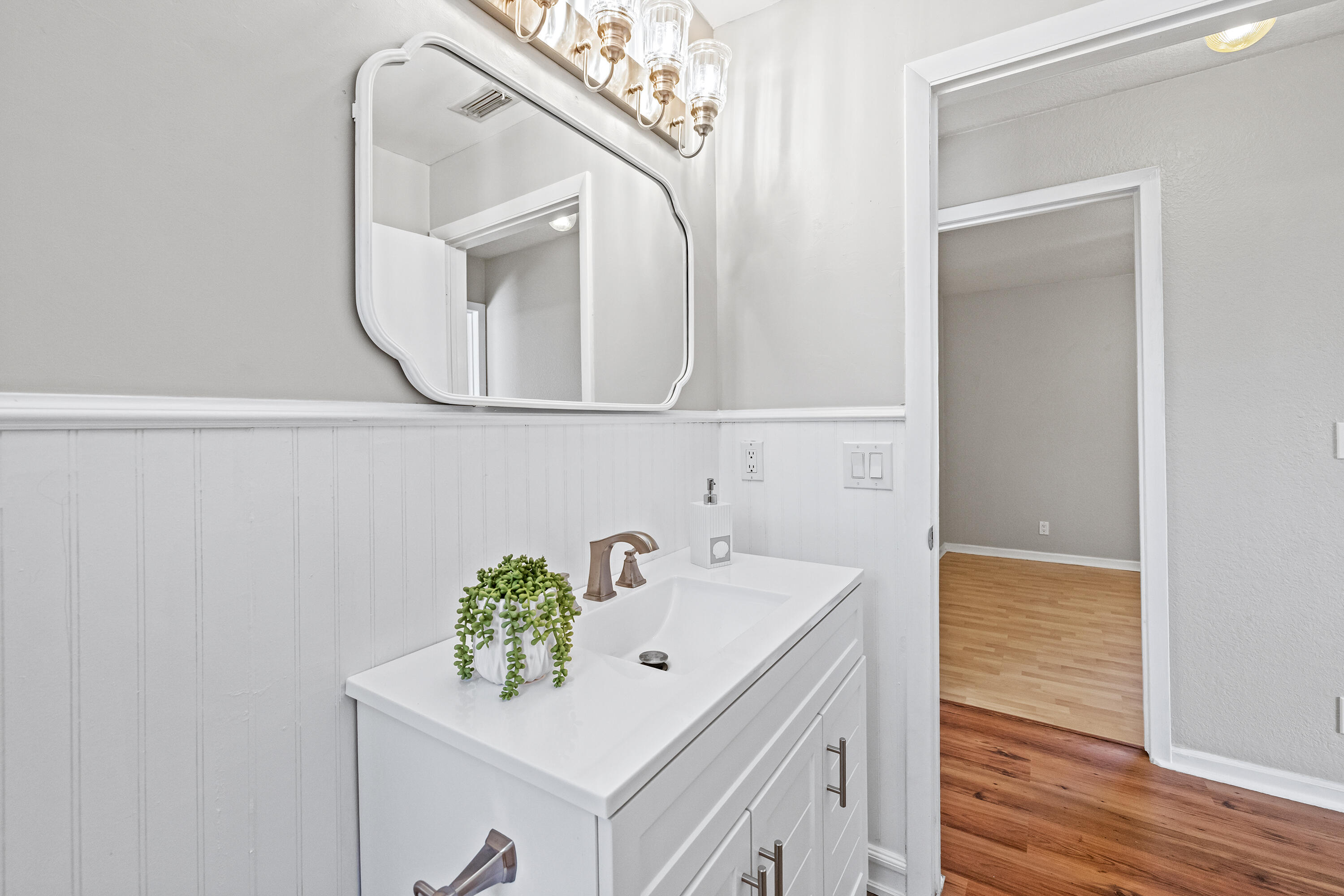15400 76th Road North Loxahatchee, FL 33470 - Photo 20 of 39 a bathroom with a sink and a mirror