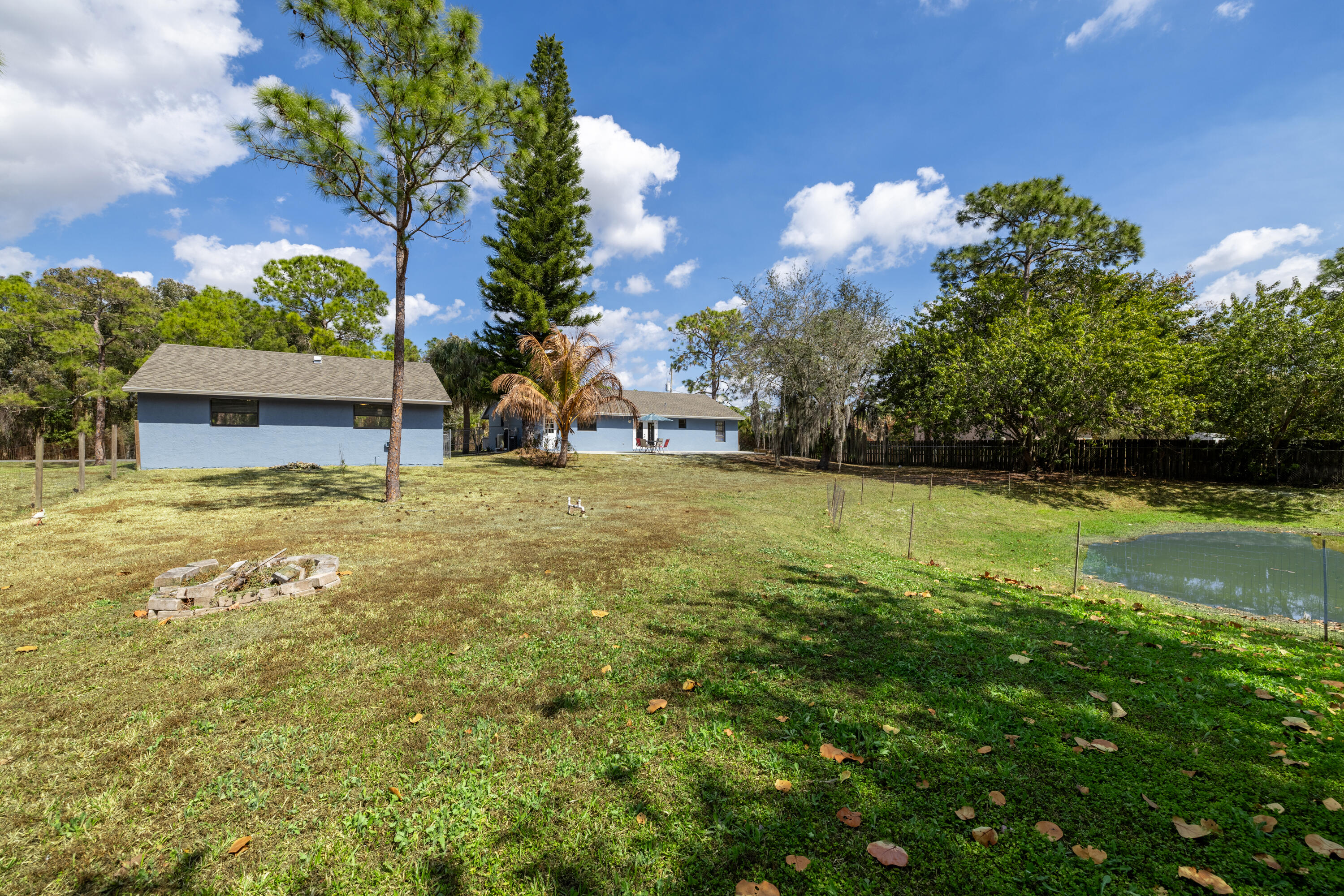 15400 76th Road North Loxahatchee, FL 33470 - Photo 27 of 39 a view of a house with a yard