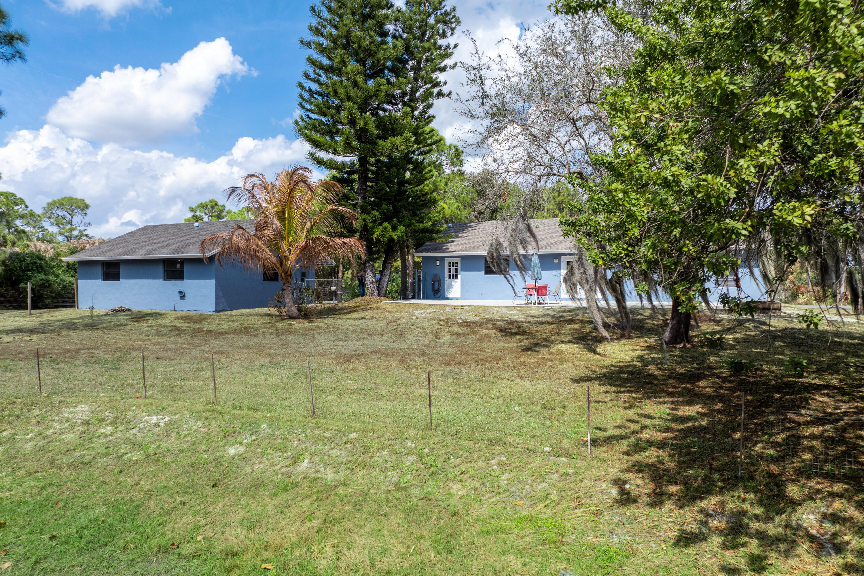 15400 76th Road North Loxahatchee, FL 33470 - Photo 28 of 39 a house view with swimming pool