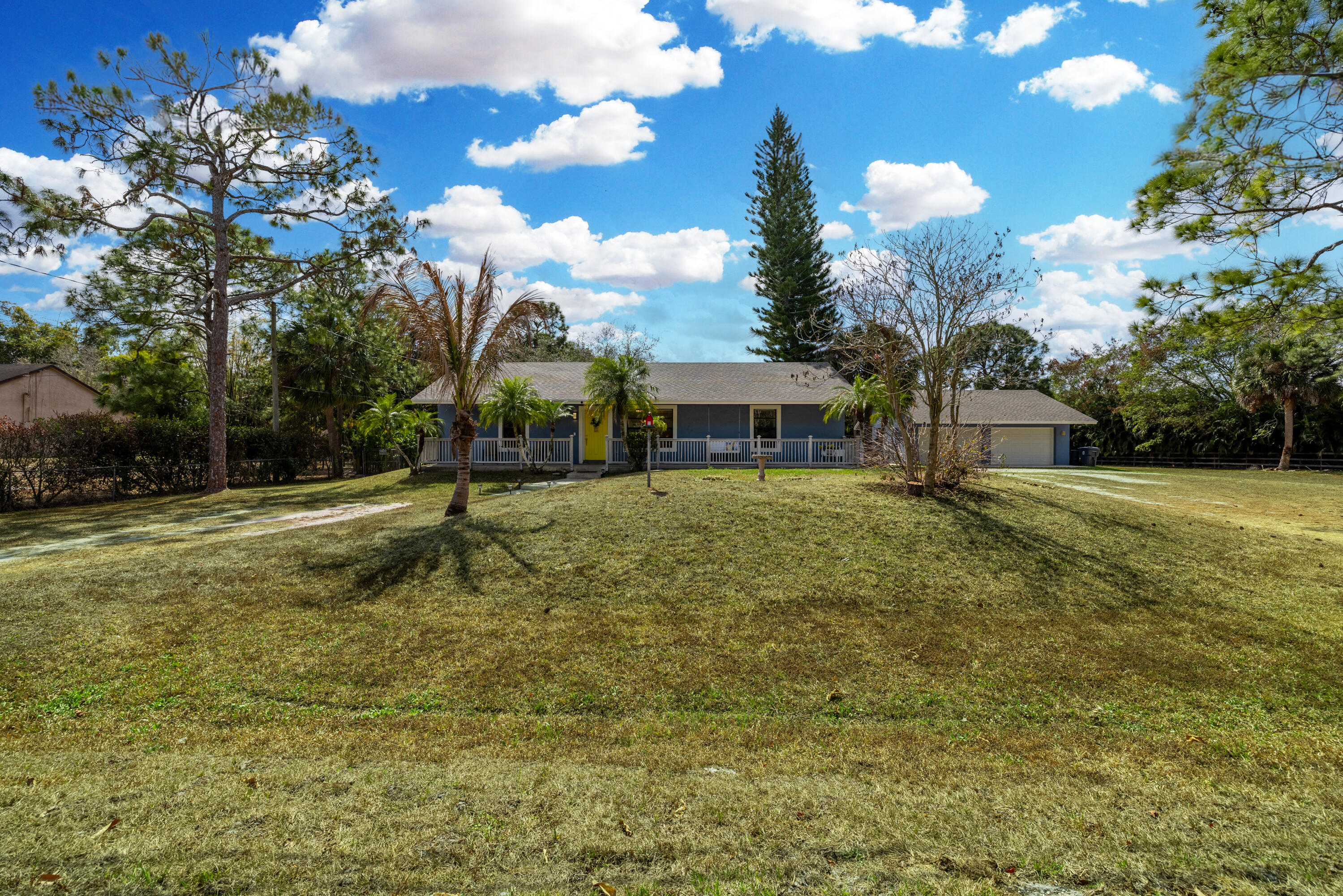 15400 76th Road North Loxahatchee, FL 33470 - Photo 30 of 39 a house view with swimming pool