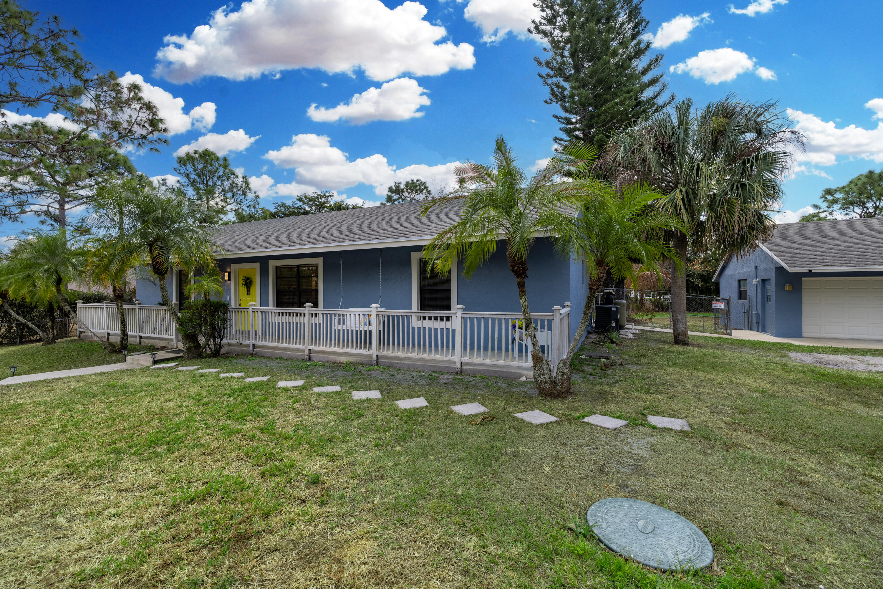 15400 76th Road North Loxahatchee, FL 33470 - Photo 31 of 39 a view of a house with a backyard