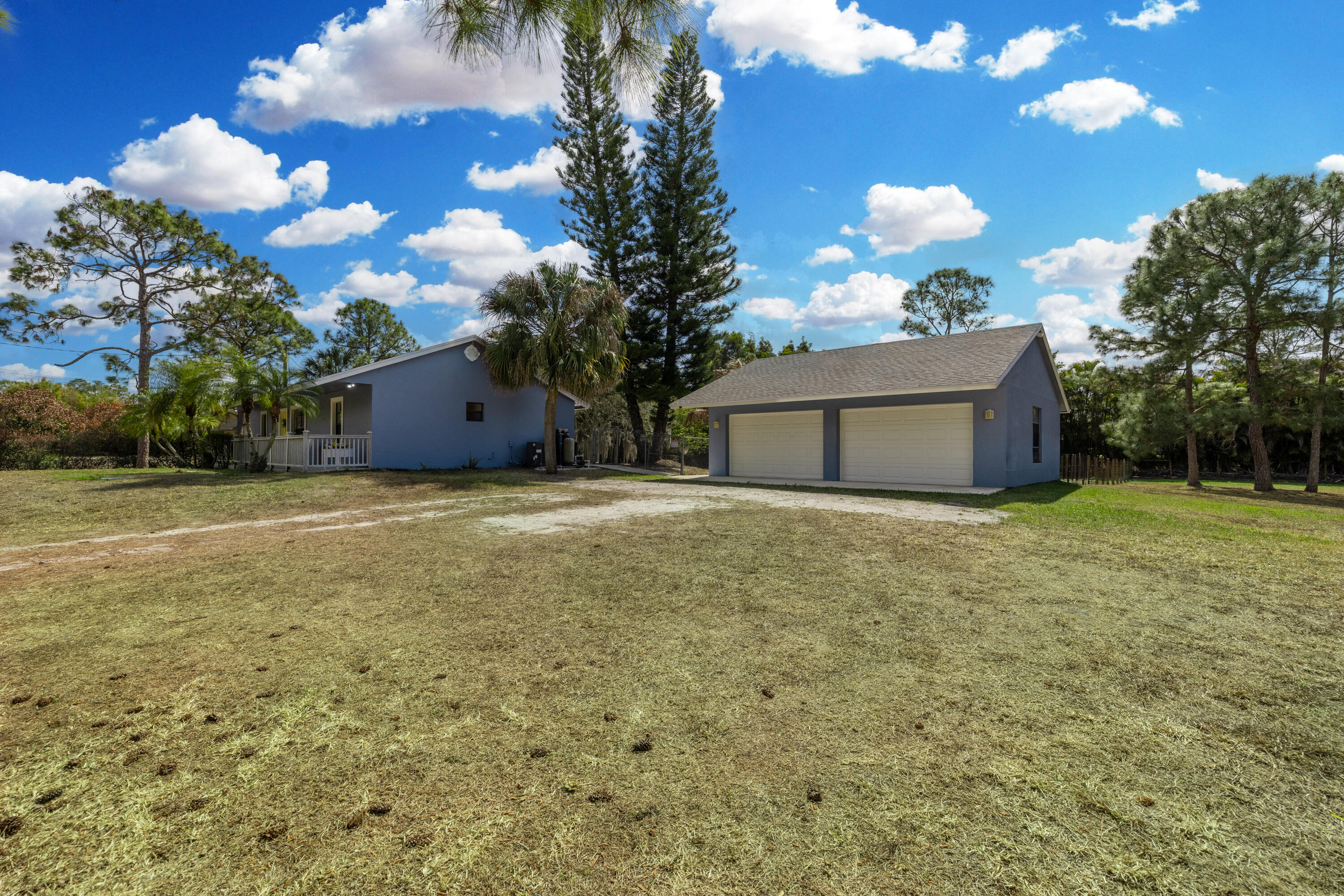 15400 76th Road North Loxahatchee, FL 33470 - Photo 33 of 39 a view of a house with a yard