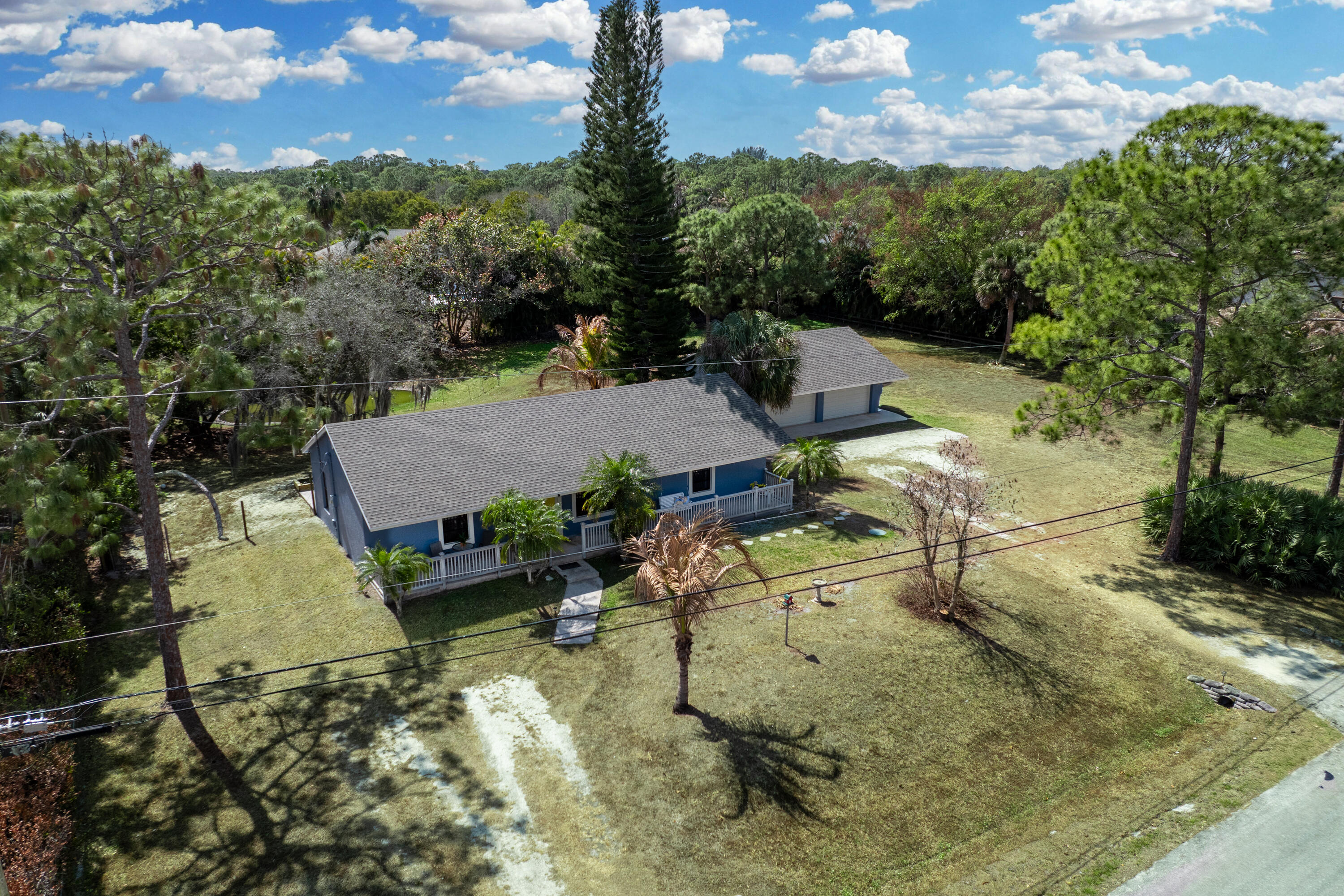 15400 76th Road North Loxahatchee, FL 33470 - Photo 34 of 39 an aerial view of a house with a yard basket ball court and outdoor seating