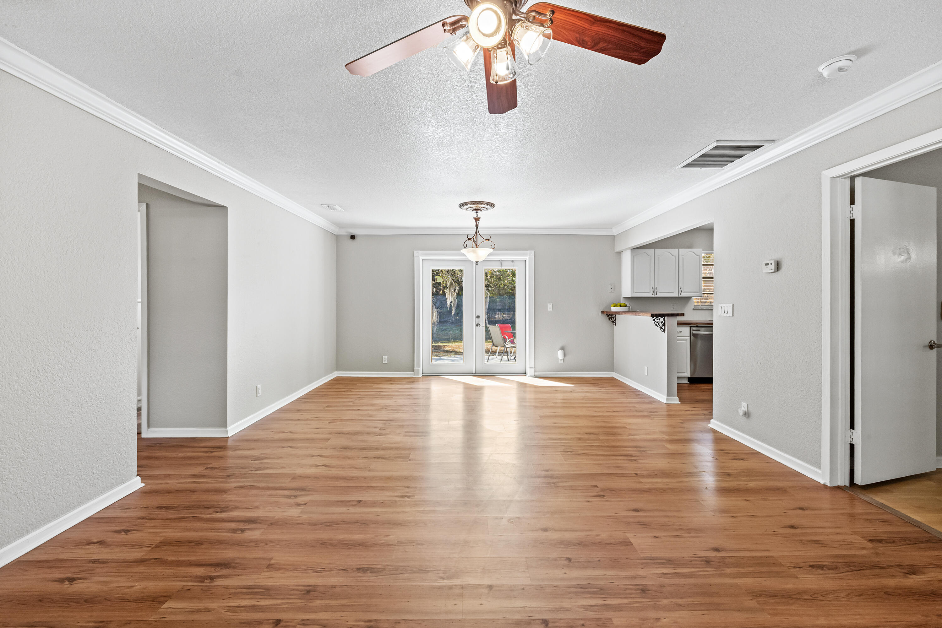 15400 76th Road North Loxahatchee, FL 33470 - Photo 6 of 39 a view of empty room with wooden floor and window