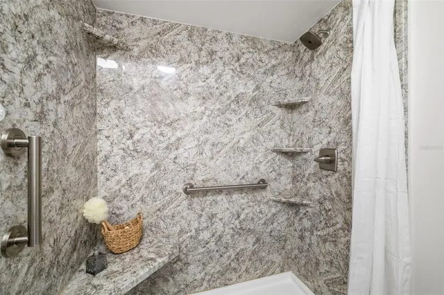 a bathroom with a shower and a toilet